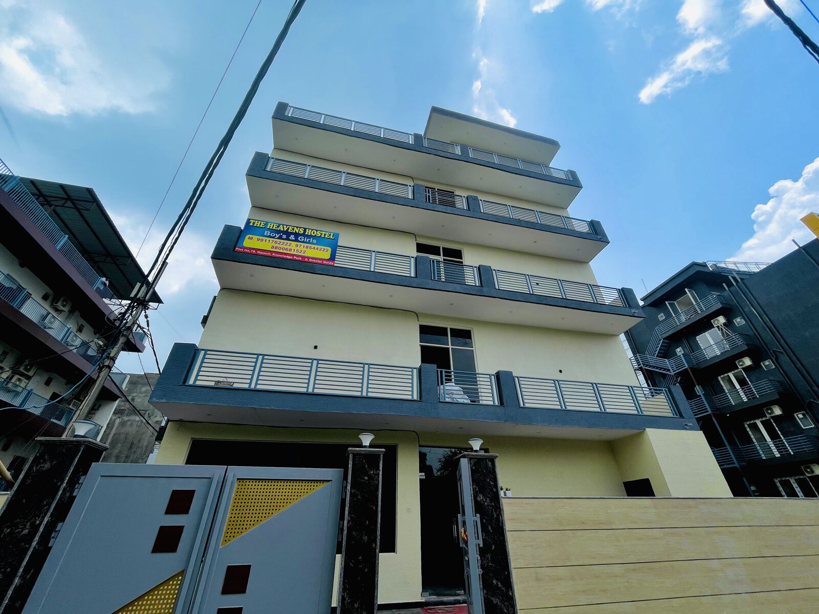 The Heavens Boys and Girls Hostel building exterior with balconies